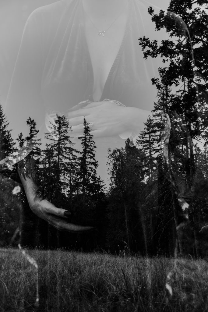 creative black and white double exposure images with pregnant woman holding her belly and forested background view taken at Spencer Butte in Eugene Oregon by family and birth photographer Lux Marina Photography